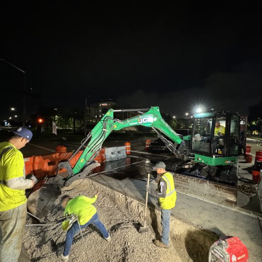 Night excavation crew working on sinkhole remediation