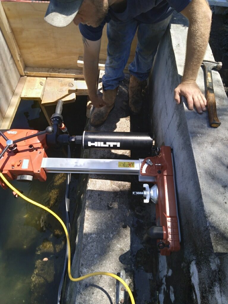 Hilti core drill equipment in seawall for jet filter installation