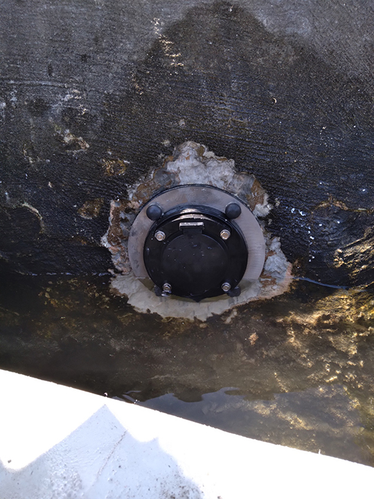 Close-up of jet filter cap sealed into seawall