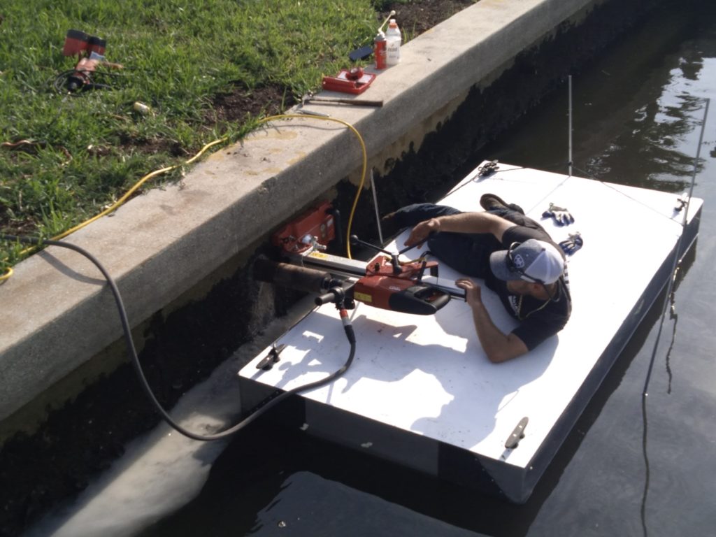 Crew injecting Prime Resin chemical grout into a seawall