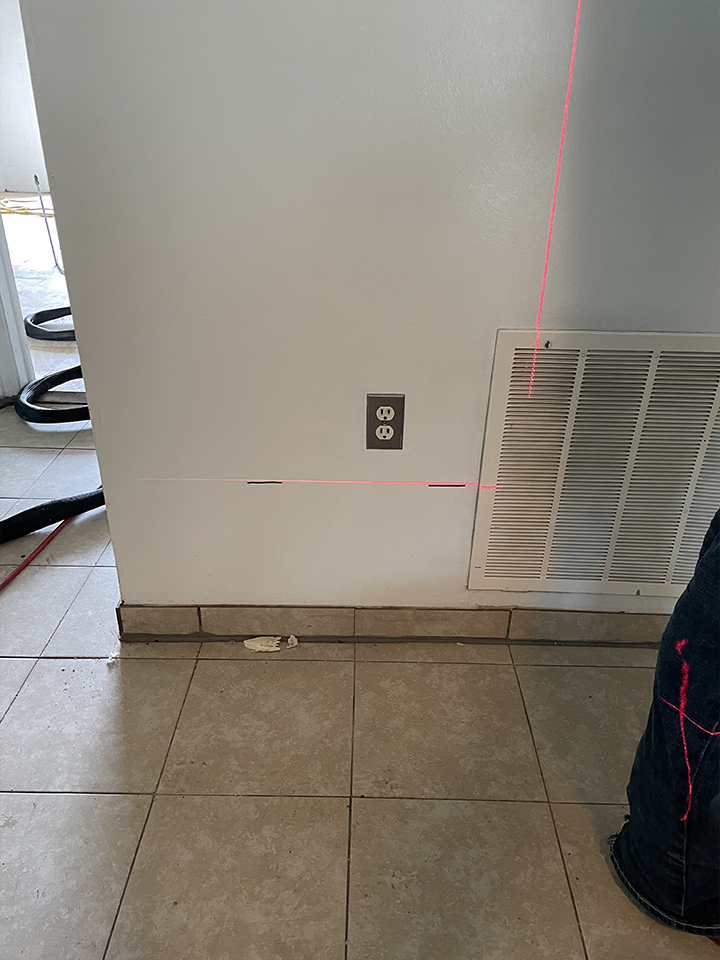 Laser level survey showing interior floor settling